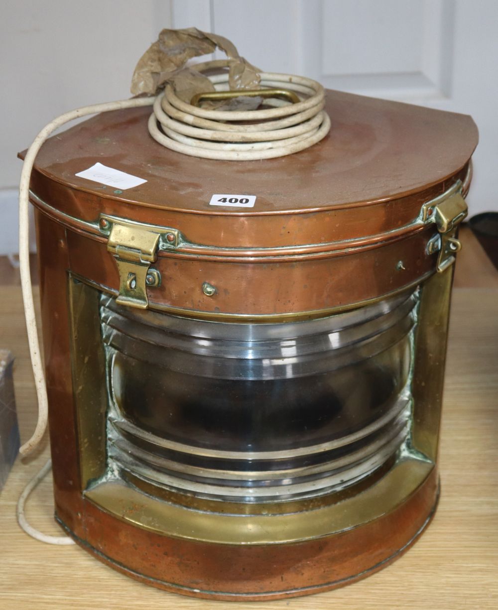A large copper and brass ships lamp, height 35cm